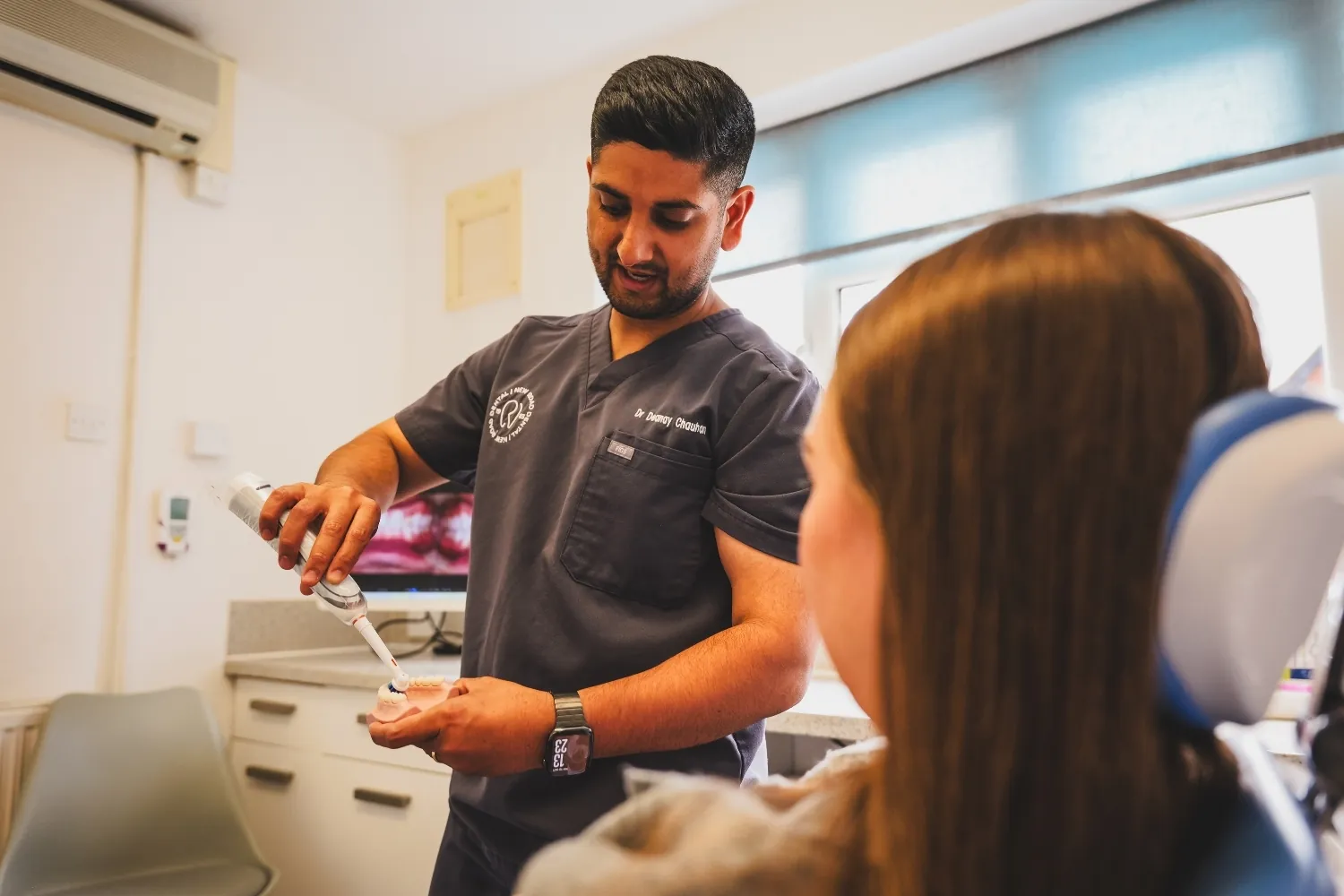 Friendly dentist at New Road Dental in Bromsgrove welcoming a patient