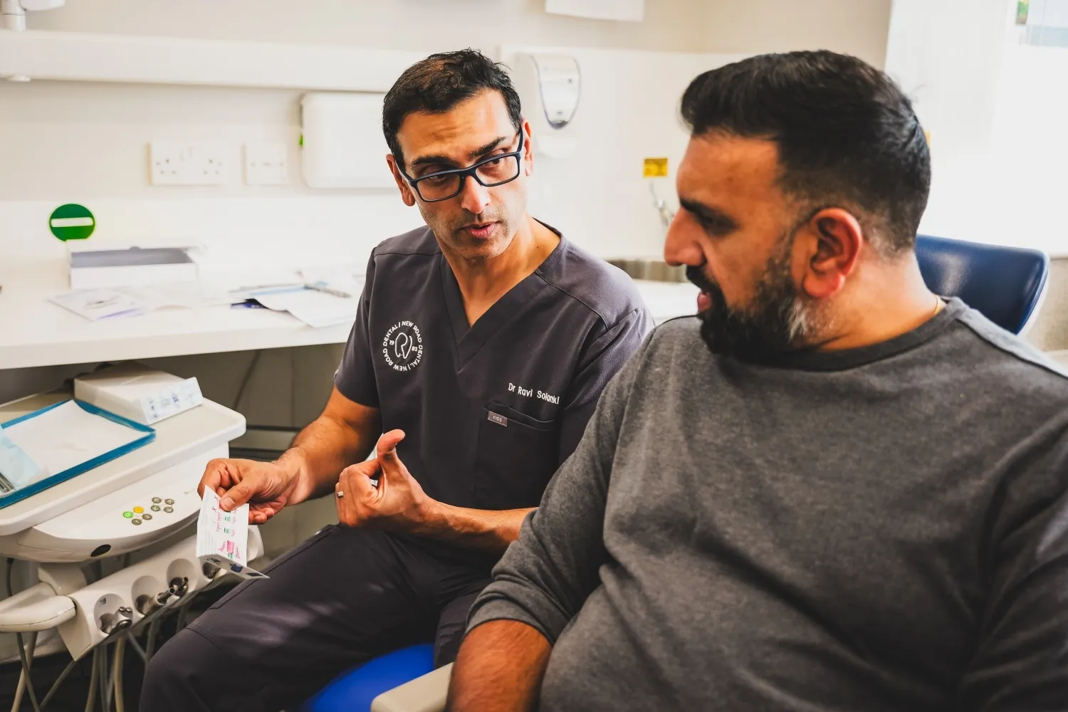 Patient Care Coordinator at New Road Dental discussing smile goals with a patient